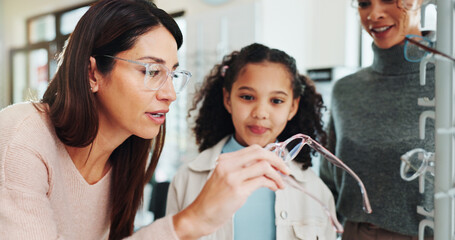 Optician, mother and child with glasses choice in optical store for prescription lens, frame style and vision. Eyewear shopping, optometry and girl customer with spectacles fitting and health service