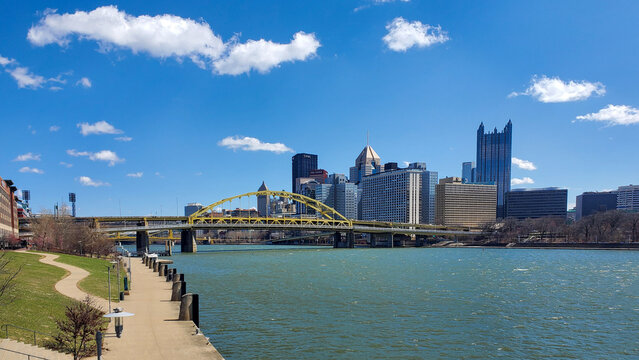 Pittsburgh, Pennsylvania, USA &ndash; April 10, 2024: Panoramic view of Point State Park where the Allegheny and Monongahela Rivers meet to form the Ohio River, with Acrisure Stadium and downtown in view.