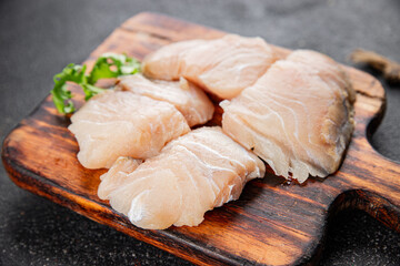 Raw fish fillet white fish seafood appetizer dish organic product fresh tasty gourmet food background on the table rustic food top view copy space pescetarian diet