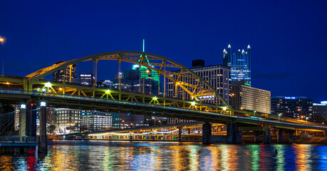 Pittsburgh City Skyline and Yellow Bridge Reflected in River at Night