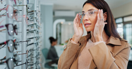 Eye care, woman and glasses choice in store with frame shopping, prescription eyewear or size fitting. Mature person, healthcare or check spectacles for vision correction, optometry or optical health © peopleimages.com