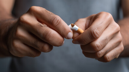 A person holding a cigarette in their hand