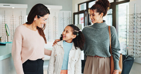 Fototapeta premium Family, optometry or vision with girl and woman in hospital for appointment, checkup and eye care. Eyewear, glasses or prescription with child and optometrist in clinic for ophthalmology consulting