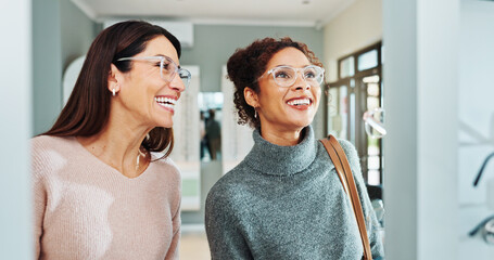 Optometry, women and client with glasses, smile and friendly service with consultation. Help, customer and professional in store, trust and advice for designer frame decision, eyewear or clear vision