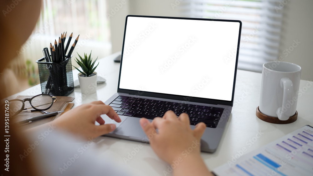 Poster person working on a laptop with an empty white screen, ready for customization.