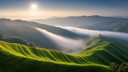 Breathtaking morning view of rolling green hills with mist and sunlight