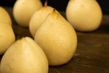 sweet pears of white color with spots on the skin close up