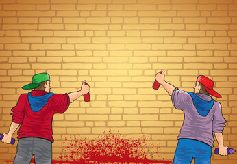 Two young street artists start painting graffiti on a wall