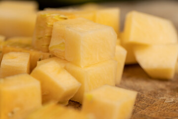 soft ripe pumpkin of orange color, fresh pumpkin for cooking, cut into pieces and cubes with seeds into pieces