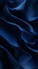 Obraz premium Elegant blue satin fabric texture with soft waves, perfect for backgrounds and designs, showcasing smooth and flowing drapery.