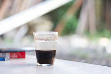Frothy Coffee in a Natural Outdoor Setting