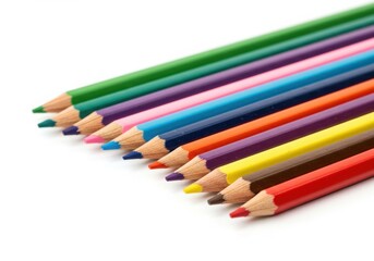 Fototapeta premium A collection of colored pencils arranged in a row on white surface on isoleted white background