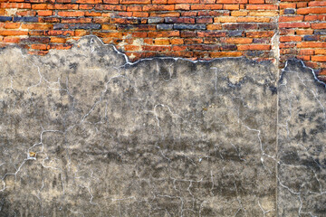 Weathered Concrete and Brick Wall with Cracks and Texture Details