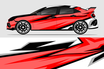 Sporty red car with dynamic graphic design parked against a neutral background, showcasing modern styling