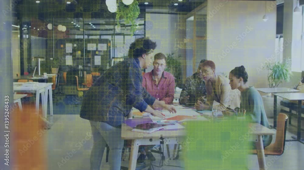 Poster team collaborating at office table with digital data processing animation overlay