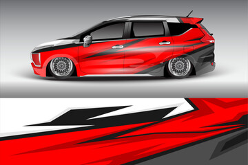 Stylish red and black car wrap design showcasing a lowered vehicle with intricate patterns