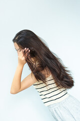 Closeup portrait of female model holding messy hair in hands, Combing with brush and pulls long hair, Daily preparation for looking nice, Long Disheveled Hair, Holding Messy Hair