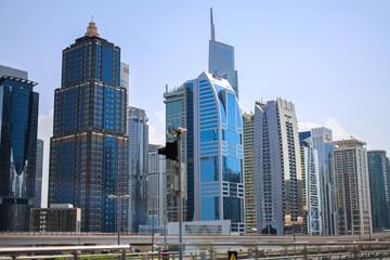 Obraz premium Urban Jungle: A Stunning Aerial View of a Modern Cityscape with Towering Skyscrapers, Reflecting the Vibrant Energy and Architectural Wonders of Contemporary Urban Life, Landscape.