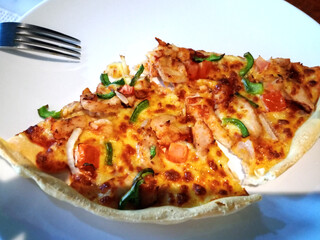 Two slices of pizza on a plate.