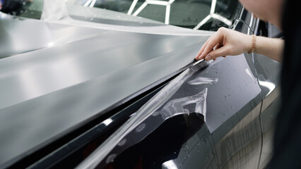 Professional wrapping car hood with vinyl film