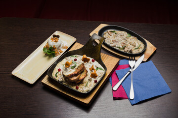 Set of potato pancakes with mushrooms, meat in sauce and dessert