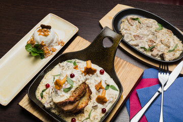 Set of potato pancakes with mushrooms, meat in sauce and dessert