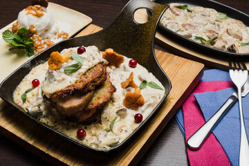 Set of potato pancakes with mushrooms, meat in sauce and dessert