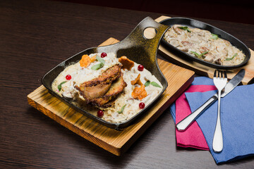 Draniki with chanterelle mushrooms, cream sauce and meat