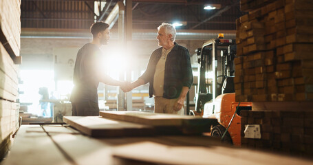 Collaboration, handshake and talking with carpenter men in workshop for manufacturing or production. Agreement, carpentry and deal with woodworking people shaking hands in factory for partnership