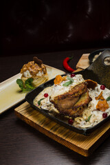 Set of potato pancakes with mushrooms, meat in sauce and dessert