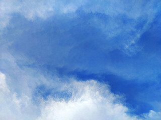 View Bright blue sky with white clouds