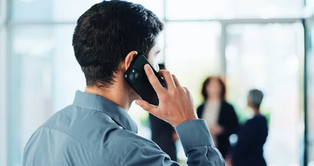  Phone call, office and back of business man for communication, contact and online discussion. Professional, corporate worker and person talking on smartphone for networking, planning and conversation © peopleimages.com