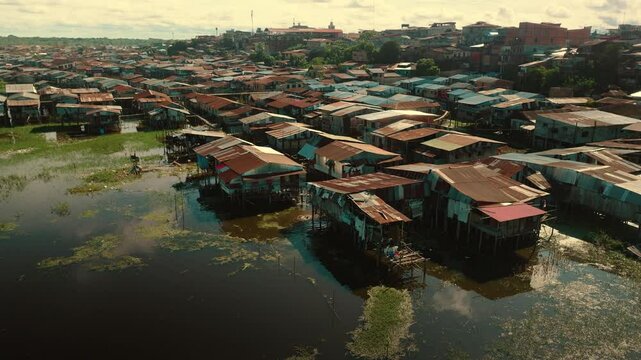 Aerial View of Flooded Iquitos (Belen District) with Wooden and Metal Stilt Houses at Sunset
