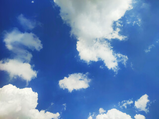 View Bright blue sky with white clouds