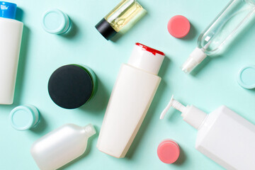 Group of plastic bodycare bottle Flat lay composition with cosmetic products on colored background...