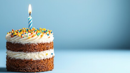 Delicious Layered Cake with Candle and Colorful Sprinkles