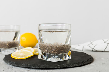 Healthy breakfast or morning with chia seeds and lemon on table background, vegetarian food, diet...