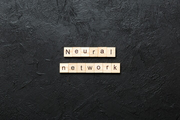 NEURAL NETWORK word written on wood block. NEURAL NETWORK text on cement table for your desing, concept