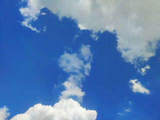 View Bright blue sky with white clouds