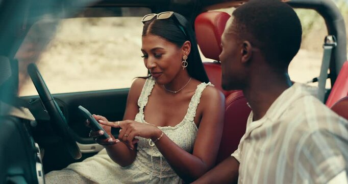 Couple, road trip and phone for direction, driving or search for location on digital map in countryside. People, woman and man with smartphone, discussion and happy on vacation with mobile app in car