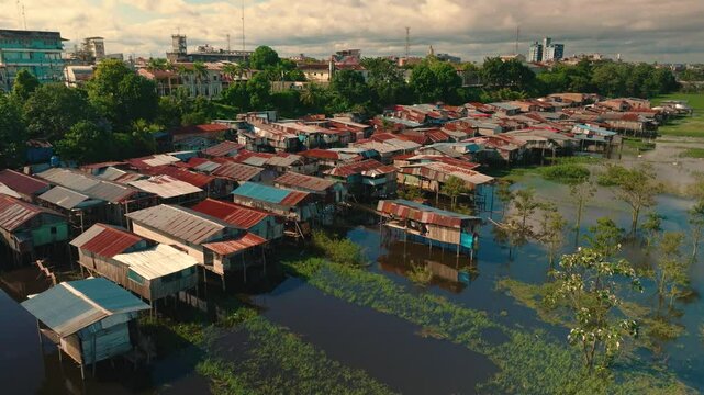 Aerial View of Flooded Iquitos (Belen District) with Wooden and Metal Stilt Houses at Sunset