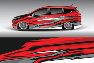 Obraz premium Stylish red and black modified car with striking graphics parked against a gradient background