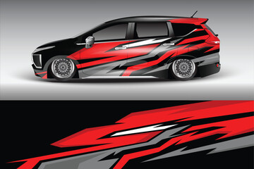Sleek modified car with bold red and black graphic design parked against a gradient backdrop