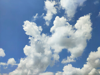 View Bright blue sky with white clouds