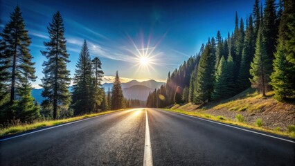 Naklejka premium Asphalt road stretching towards majestic mountains at sunset, flanked by tall evergreen trees under a vibrant sky