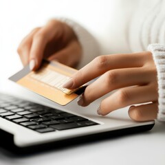 Woman's Hands Using Credit Card for Online Payment on Laptop