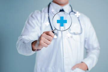 Medical Professional Examining Health Symbols with Magnifying Glass