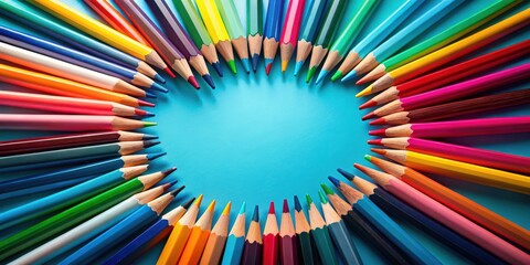 Vibrant colored pencils arranged in a circular frame on a bright blue background, ideal for creative projects and design inspiration