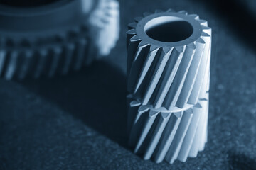 Close up scene small gear shape part from the metal 3D printing method in the light blue scene.