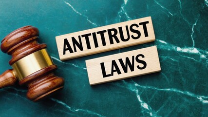 Antitrust Laws with Gavel on Green Marble Background